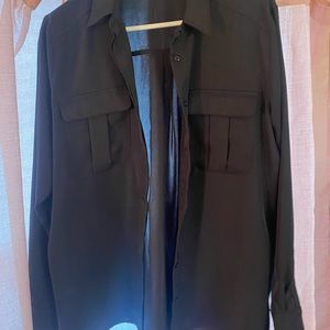 Express Size Large button down blouse. Material is polyester. Large fit.